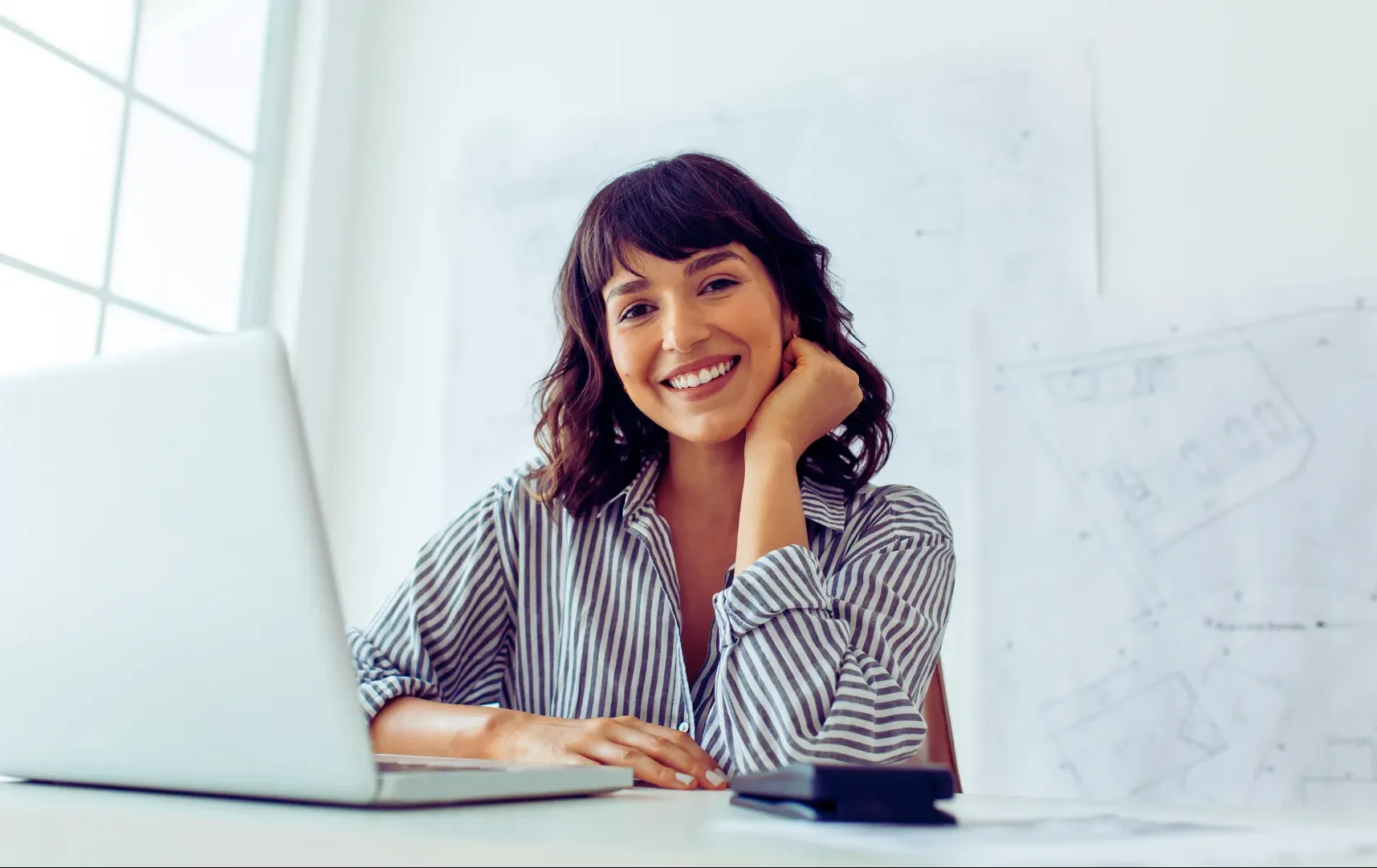 London Architect London Architect Jane Sinclair smiling at her desk 1